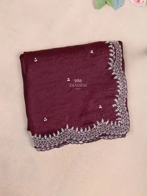 Burgundy Semi Organza Saree with Floral Designs on the body and Embroidery Border